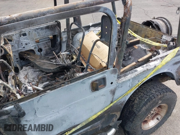 2000 Jeep Wrangler Sport with VIN 1J4FA49S5YP797345, listed as a IAAI auction lot 40322775 with Not Provided miles and . Bid and sale history available at DreamBid. Image 15.