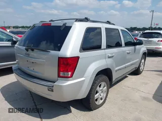 2010 Jeep Grand Cherokee Laredo with VIN 1J4PR4GK1AC143780, listed as a IAAI auction lot 42058575 with 88,608 mi miles. Bid and sale history available at carsss.com. Image 4.