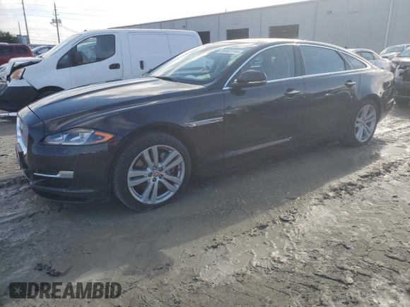 2016 Jaguar XJ Portfolio with VIN SAJWJ2GDXG8W03143, listed as a Copart auction lot 86467114 with 42,923 mi miles and Salvage title. Bid and sale history available at DreamBid. Image 1.