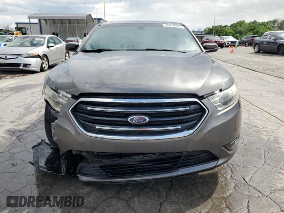 2014 Ford Taurus SEL z VIN 1FAHP2E80EG174910, wystawiony jako Copart lot #56070945 z przebiegiem 147 201 mil mil oraz Szkody całkowita. Historia ofert i sprzedaży dostępna na DreamBid. Obrazek 5.