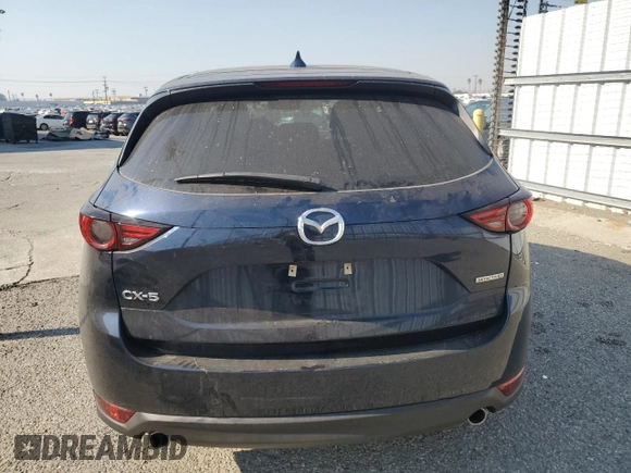 2021 Mazda CX-5 Grand Touring with VIN JM3KFADM7M0385788, listed as a Copart auction lot 88065255 with 27,787 mi miles and Salvage Title. Bid and sale history available at carsss.com. Image 6.