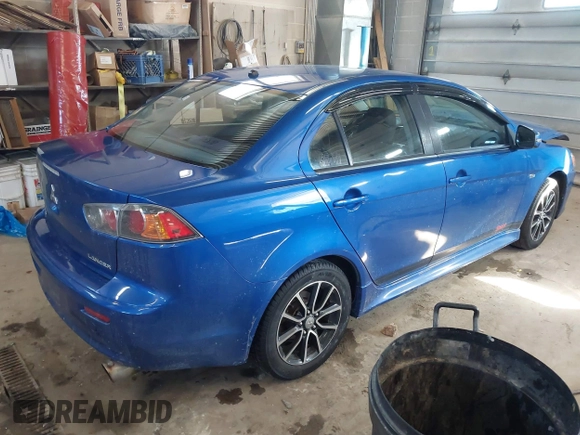 2017 Mitsubishi Lancer ES with VIN JA32V2FW4HU006890, listed as a IAAI auction lot 41636035 with 165,077 mi miles. Bid and sale history available at carsss.com. Image 4.