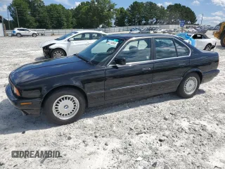 1994 BMW 5 Series 525i z VIN WBAHD632XRGK42996, wystawiony jako Copart lot #61163665 z przebiegiem 164 621 mil mil oraz Czysty tytuł • Clean title. Historia ofert i sprzedaży dostępna na DreamBid. Obrazek 1.