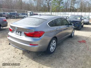 2014 BMW 5 Series Gran Turismo 535i with VIN WBA5M2C53ED871971, listed as a IAAI auction lot 41739128 with 156,019 mi miles. Bid and sale history available at carsss.com. Image 4.