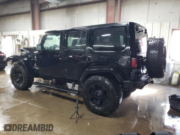 2015 Jeep Wrangler Unlimited Rubicon Hard Rock with VIN 1C4HJWFG4FL676868, listed as a Copart auction lot 48489525 with 100,771 mi miles and Salvage title. Bid and sale history available at DreamBid. Image 2.