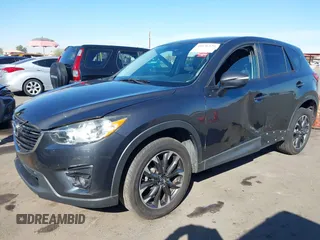 2016 Mazda CX-5 Grand Touring z VIN JM3KE2DYXG0649781, wystawiony jako IAAI lot #41636329 z przebiegiem 83 433 mil mil oraz . Historia ofert i sprzedaży dostępna na DreamBid. Obrazek 17.