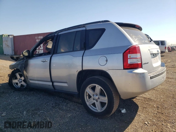 2010 Jeep Compass Sport with VIN 1J4NF4FB1AD672772, listed as a Copart auction lot 74220304 with 0 mi miles and Salvage Title. Bid and sale history available at carsss.com. Image 2.