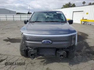 2023 Ford F-150 Lightning Pro with VIN 1FT6W1EV0PWG34788, listed as a Copart auction lot 54454805 with 11,432 mi miles and Salvage title. Bid and sale history available at DreamBid. Image 5.