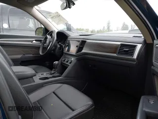 2021 Volkswagen Atlas SE z VIN 1V2WR2CA7MC568779, wystawiony jako IAAI lot #42132709 z przebiegiem 51 205 mil mil oraz . Historia ofert i sprzedaży dostępna na DreamBid. Obrazek 5.