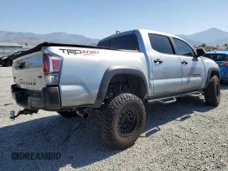 2023 Toyota Tacoma SR with VIN 3TMCZ5AN8PM545588, listed as a Copart auction lot 57528655 with 73,286 mi miles and Salvage title. Bid and sale history available at DreamBid. Image 3.