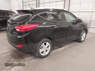 2013 Hyundai Tucson GLS with VIN KM8JU3AC8DU557445, listed as a IAAI auction lot 41839782 with 153,769 mi miles. Bid and sale history available at carsss.com. Image 4.