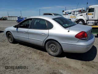 2005 Ford Taurus SE with VIN 1FAFP53U25A303516, listed as a Copart auction lot 63250505 with 203,463 mi miles and Salvage title. Bid and sale history available at DreamBid. Image 2.
