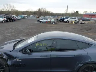 2021 Tesla Model S Long Range with VIN 5YJSA1E5XMF428519, listed as a IAAI auction lot 41926242 with 54,284 mi miles and . Bid and sale history available at DreamBid. Image 14.