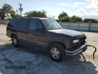 1997 GMC Yukon with VIN 1GKEK13R7VJ711782, listed as a Copart auction lot 74793184 with 208,718 mi miles and Salvage Title. Bid and sale history available at carsss.com. Image 4.