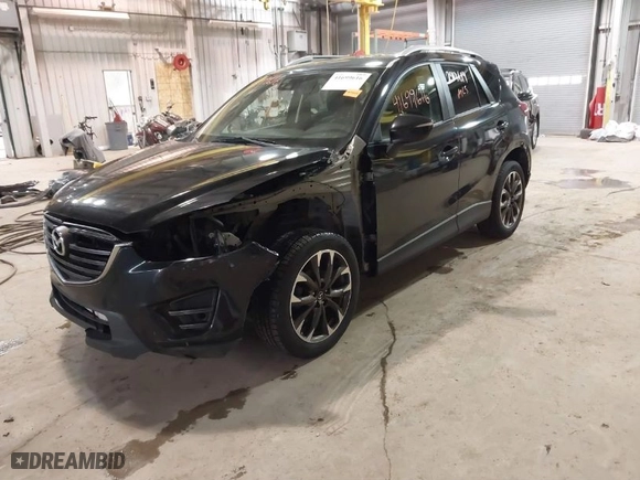 2016 Mazda CX-5 Grand Touring with VIN JM3KE2DY9G0635368, listed as a IAAI auction lot 41699616 with 240,619 mi miles. Bid and sale history available at carsss.com. Image 2.