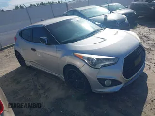 2013 Hyundai Veloster Turbo with VIN KMHTC6AE5DU112756, listed as a IAAI auction lot 42854505 with 99,015 mi miles and . Bid and sale history available at DreamBid. Image 1.