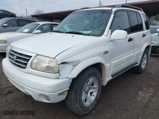 2001 Suzuki Grand Vitara JLX with VIN JS3TD62V114157738, listed as a IAAI auction lot 41721813 with 134,661 mi miles. Bid and sale history available at carsss.com. Image 2.