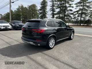 2019 BMW X5 xDrive40i with VIN 5UXCR6C57KLL62128, listed as a Copart auction lot 49959995 with 154,636 mi miles and Clean title. Bid and sale history available at DreamBid. Image 4.