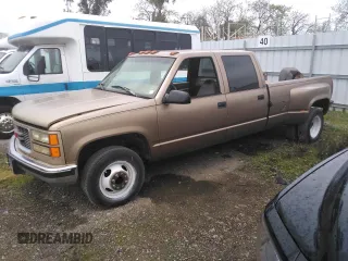1996 GMC Sierra 1500 with VIN 1GTHC33J4TF010466, listed as a Copart auction lot 48392195 with 143,267 mi miles and Salvage Title. Bid and sale history available at DreamBid. Image 1.