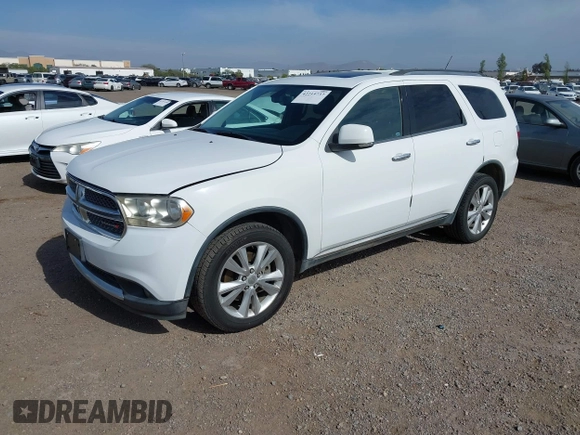 2013 Dodge Durango Crew with VIN 1C4SDHDT2DC679600, listed as a IAAI auction lot 42215737 with 128,499 mi miles and . Bid and sale history available at DreamBid. Image 2.