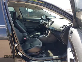 2016 Mitsubishi Lancer GT with VIN JA32U8FW8GU011501, listed as a IAAI auction lot 41779016 with 153,082 mi miles. Bid and sale history available at carsss.com. Image 5.