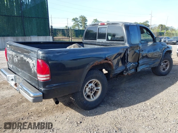 1999 Dodge Dakota SLT with VIN 1B7GG22X8XS115282, listed as a IAAI auction lot 42136576 with 220,465 mi miles and . Bid and sale history available at carsss.com. Image 4.