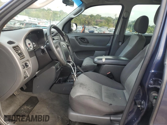 2004 Ford Escape XLS with VIN 1FMYU92104KA21454, listed as a Copart auction lot 74139564 with 217,731 mi miles and Salvage Title. Bid and sale history available at DreamBid. Image 7.