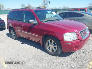 2002 GMC Envoy SLT with VIN 1GKDS13S922205147, listed as a IAAI auction lot 42041118 with 127,400 mi miles. Bid and sale history available at carsss.com. Image 1.