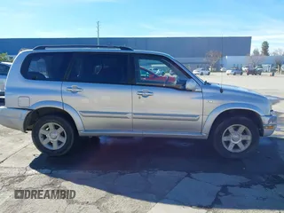 2003 Suzuki XL7 Touring z VIN JS3TX92V734114162, wystawiony jako IAAI lot #41250622 z przebiegiem 227 494 mil mil oraz . Historia ofert i sprzedaży dostępna na DreamBid. Obrazek 14.