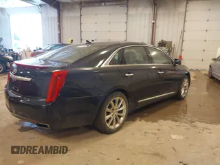 2014 Cadillac XTS Luxury with VIN 2G61M5S39E9325923, listed as a IAAI auction lot 41253343 with 69,319 mi miles. Bid and sale history available at carsss.com. Image 4.