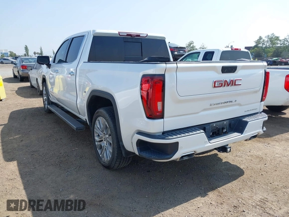 2021 GMC Sierra 1500 Denali z VIN 3GTU9FEL1MG349215, wystawiony jako IAAI lot #42585810 z przebiegiem 97 465 mil mil oraz . Historia ofert i sprzedaży dostępna na DreamBid. Obrazek 3.