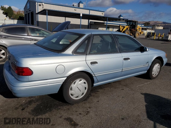 1993 Ford Taurus with VIN 1FACP5216PG197713, listed as a Copart auction lot 80982424 with 79,330 mi miles and Salvage title. Bid and sale history available at DreamBid. Image 3.