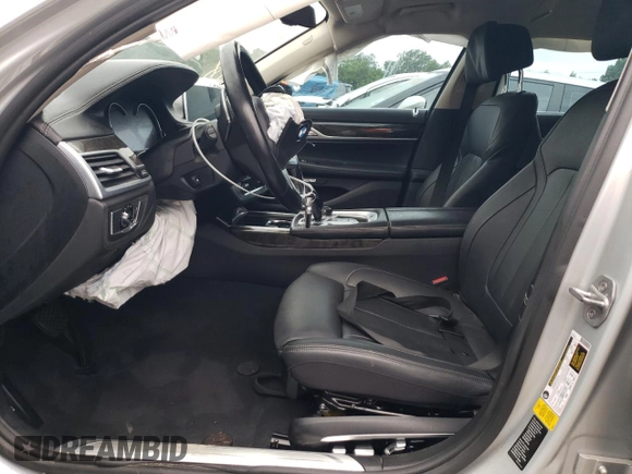 2017 BMW 7 Series 740i with VIN WBA7E2C52HG739521, listed as a Copart auction lot 64263324 with 0 mi miles and Salvage Title. Bid and sale history available at carsss.com. Image 7.