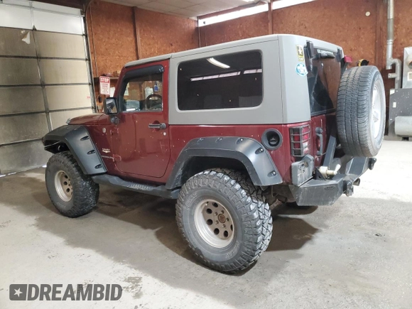 2007 Jeep Wrangler Sahara z VIN 1J4FA54127L132543, wystawiony jako Copart lot #55891995 z przebiegiem 74 616 mil mil oraz Szkoda całkowita • Salvage title. Historia ofert i sprzedaży dostępna na DreamBid. Obrazek 2.