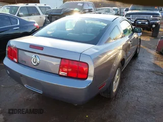 2007 Ford Mustang Deluxe z VIN 1ZVFT80N975302845, wystawiony jako IAAI lot #41615150 z przebiegiem Nie podano mil oraz . Historia ofert i sprzedaży dostępna na DreamBid. Obrazek 4.
