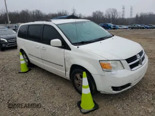 2010 Dodge Grand Caravan SXT with VIN 2D4RN5D12AR244722, listed as a Copart auction lot 43725005 with 210,546 mi miles and Clean Title. Bid and sale history available at DreamBid. Image 4.