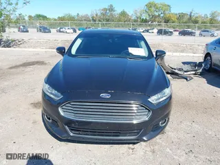 2015 Ford Fusion Titanium Hybrid with VIN 3FA6P0RUXFR119698, listed as a IAAI auction lot 41791411 with 140,646 mi miles. Bid and sale history available at carsss.com. Image 13.