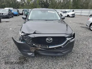 2020 Mazda CX-5 Grand Touring with VIN JM3KFADM6L0839527, listed as a Copart auction lot 46677475 with 50,305 mi miles and Salvage Title. Bid and sale history available at DreamBid. Image 5.