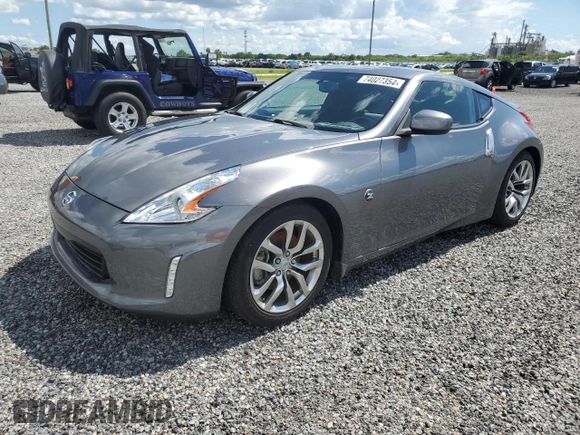 2014 Nissan 370Z with VIN JN1AZ4EH6EM633797, listed as a Copart auction lot 74027354 with Not Provided miles and Salvage Title. Bid and sale history available at DreamBid. Image 1.