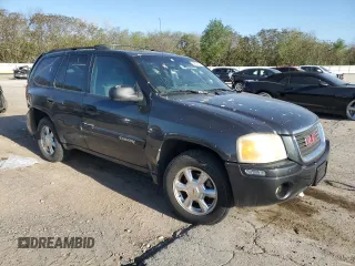 2004 GMC Envoy SLE with VIN 1GKDT13S042404250, listed as a Copart auction lot 52672455 with 230,610 mi miles and Salvage Title. Bid and sale history available at carsss.com. Image 4.