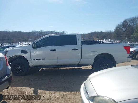 2018 Nissan Titan XD SV with VIN 1N6BA1F40JN523851, listed as a IAAI auction lot 41800730 with 104,527 mi miles. Bid and sale history available at carsss.com. Image 14.