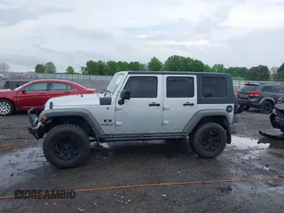 2007 Jeep Wrangler Unlimited X with VIN 1J4GA39187L209448, listed as a IAAI auction lot 42104328 with 138,302 mi miles and . Bid and sale history available at DreamBid. Image 14.