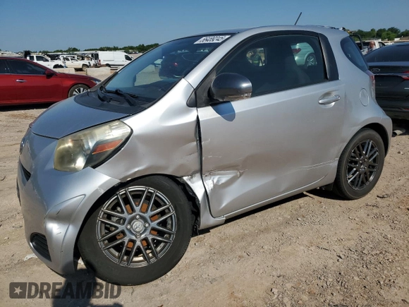 2012 Scion iQ with VIN JTNJJXB05CJ010539, listed as a Copart auction lot 56489245 with 114,623 mi miles and Salvage title. Bid and sale history available at DreamBid. Image 1.