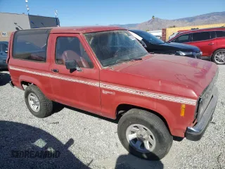 1988 Ford Bronco с VIN 1FMCU12T0JUD60132, выставлен на аукционе Copart как лот 81643864 с пробегом 9 594 миль миль и Чистый • Clean title. История ставок и продаж доступна на DreamBid. Изображение 4.