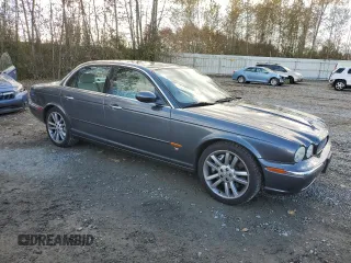 2005 Jaguar XJ with VIN SAJWA73B05TG40023, listed as a Copart auction lot 73163814 with 95,818 mi miles and Salvage Title. Bid and sale history available at carsss.com. Image 4.