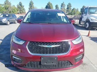 2021 Chrysler Pacifica Hybrid Touring L with VIN 2C4RC1L76MR581285, listed as a IAAI auction lot 42303222 with 77,808 mi miles and . Bid and sale history available at DreamBid. Image 12.