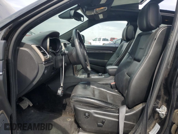 2015 Jeep Grand Cherokee Summit with VIN 1C4RJFJG2FC913658, listed as a Copart auction lot 52160035 with 138,008 mi miles and Salvage Title. Bid and sale history available at DreamBid. Image 7.