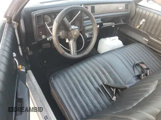 1984 Chevrolet El Camino z VIN 1GCCW80H6ER150486, wystawiony jako Copart lot #76031834 z przebiegiem 77 554 mil mil oraz Szkoda całkowita • Salvage title. Historia ofert i sprzedaży dostępna na DreamBid. Obrazek 8.
