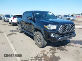 2021 Toyota Tacoma SR z VIN 3TMCZ5AN3MM421868, wystawiony jako IAAI lot #42003665 z przebiegiem 39 380 mil mil oraz . Historia ofert i sprzedaży dostępna na DreamBid. Obrazek 1.