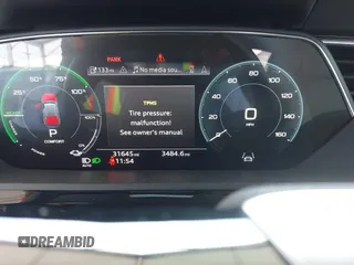 2021 Audi e-tron Premium Plus with VIN WA1LAAGE4MB038563, listed as a IAAI auction lot 42422063 with 31,645 mi miles and . Bid and sale history available at DreamBid. Image 7.